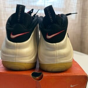 Nike Metallic Silver Foamposite Sneakers with Black and Red Accents